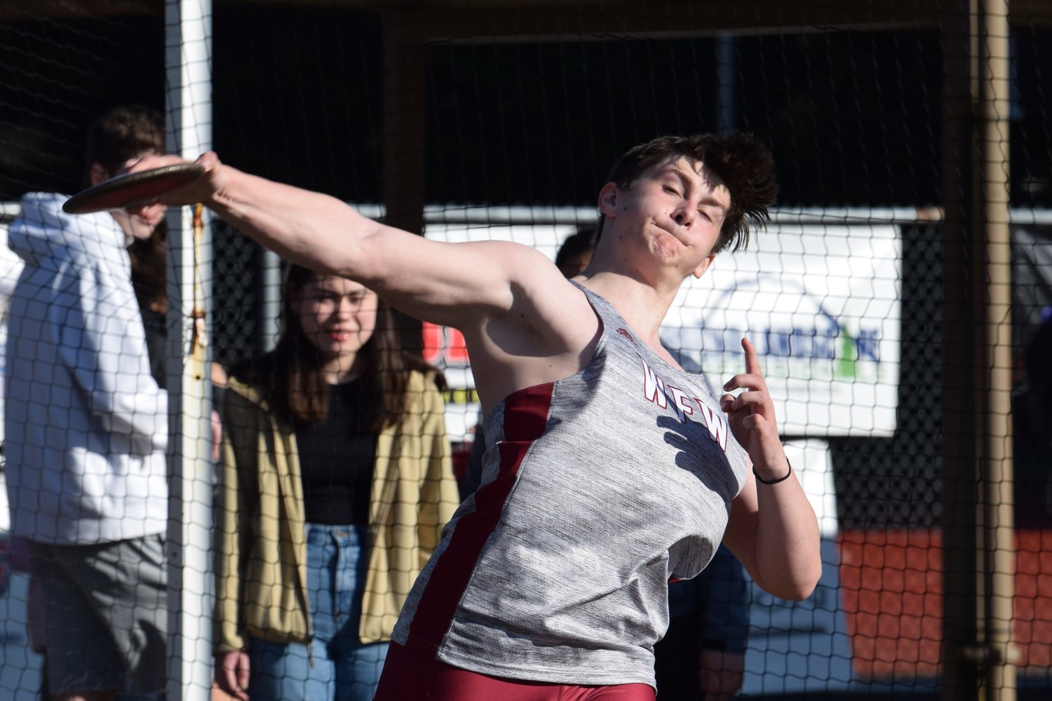 Mason Dowling throws the discus at W.F. West's dual meet at Tumwater on March 21.